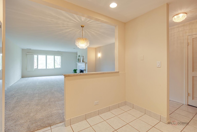 1088 Shermer Rd Unit 307, Northbrook, IL 60062 - unfurnished room with a chandelier, light tile patterned floors, baseboards, and recessed lighting