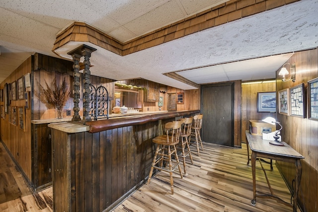 624 Joshua Ct, Naperville, IL 60540 - indoor dry bar with wood walls, wood finished floors, and a paneled ceiling