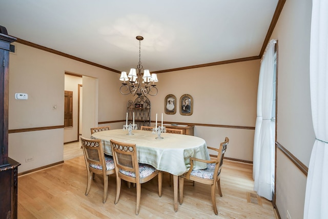 624 Joshua Ct, Naperville, IL 60540 - dining room with a chandelier, light wood finished floors, baseboards, and crown molding