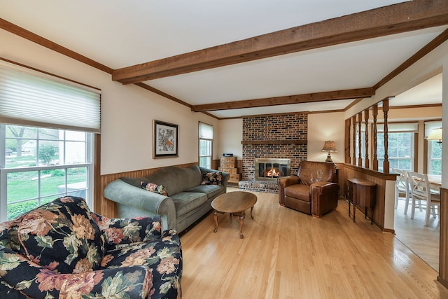 624 Joshua Ct, Naperville, IL 60540 - living area with light wood finished floors, beamed ceiling, and a brick fireplace