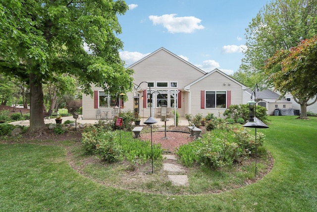 2207 Olde Mill Ln, Mchenry, IL 60050 - rear view of house featuring a yard and a patio