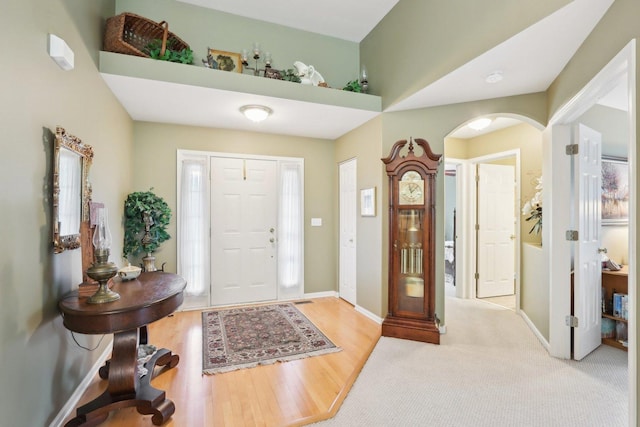 2207 Olde Mill Ln, Mchenry, IL 60050 - entryway with arched walkways, baseboards, and wood finished floors