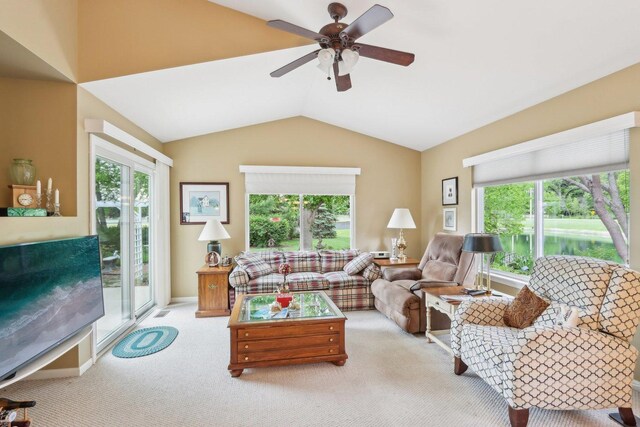 2207 Olde Mill Ln, Mchenry, IL 60050 - carpeted living area with plenty of natural light, lofted ceiling, and a ceiling fan