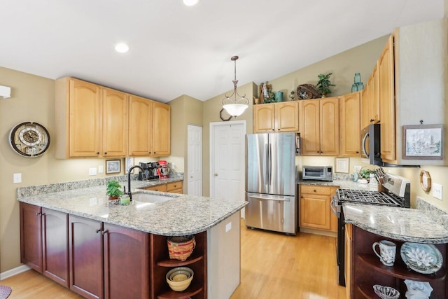 2207 Olde Mill Ln, Mchenry, IL 60050 - kitchen with open shelves, stainless steel appliances, a sink, light wood-style floors, and a peninsula