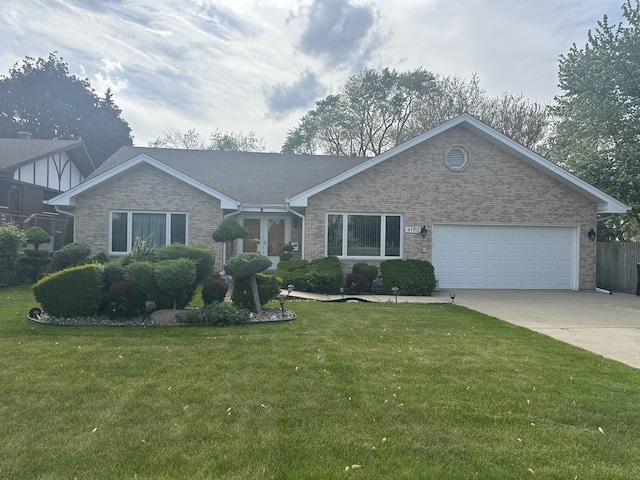 view of front of property with brick siding, concrete driveway, a front yard, and an attached garage