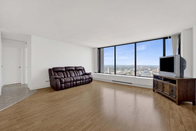 5455 N Sheridan Rd Unit 3611, Chicago, IL 60640 - unfurnished living room with light wood-style floors and baseboards