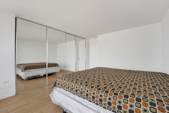 5455 N Sheridan Rd Unit 3611, Chicago, IL 60640 - bedroom with wood finished floors and a closet