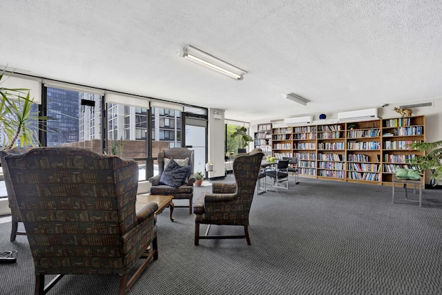 5455 N Sheridan Rd Unit 3611, Chicago, IL 60640 - living area with carpet, a wall mounted air conditioner, a textured ceiling, and wall of books
