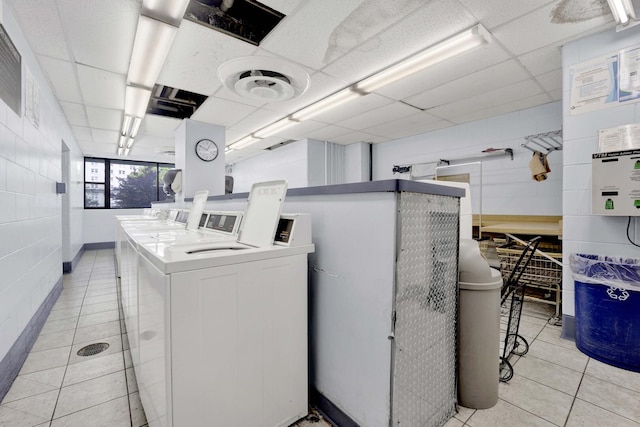 5455 N Sheridan Rd Unit 3611, Chicago, IL 60640 - community laundry room featuring light tile patterned flooring and separate washer and dryer