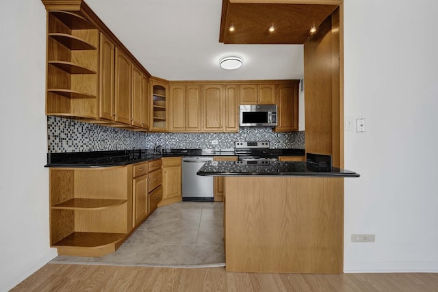 5455 N Sheridan Rd Unit 3611, Chicago, IL 60640 - kitchen with open shelves, appliances with stainless steel finishes, decorative backsplash, and dark countertops