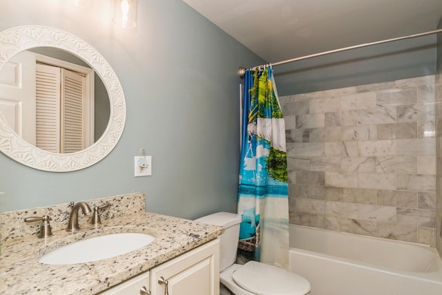 full bath with vanity, toilet, and shower / bath combo with shower curtain