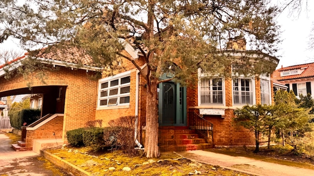 1112 Sheridan Rd, Wilmette, IL 60091 - view of front of house with brick siding and a chimney