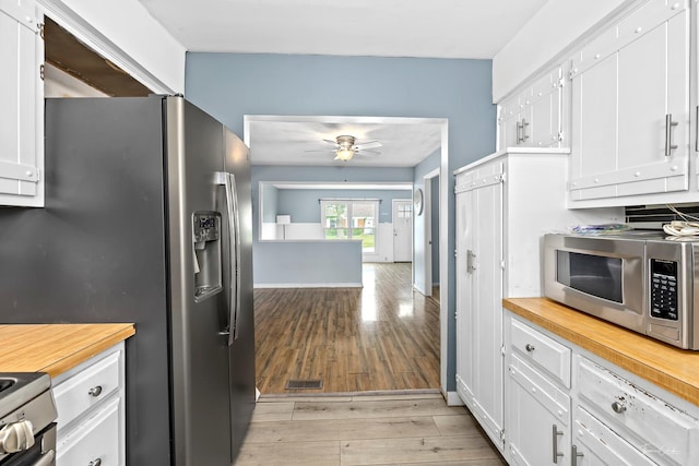 440 Berkshire Ave, Romeoville, IL 60446 - kitchen with appliances with stainless steel finishes, butcher block countertops, a ceiling fan, and white cabinets