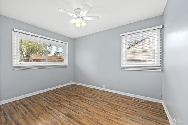 440 Berkshire Ave, Romeoville, IL 60446 - unfurnished room with wood finished floors, baseboards, and ceiling fan