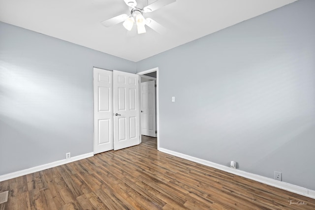 440 Berkshire Ave, Romeoville, IL 60446 - unfurnished bedroom featuring baseboards, wood finished floors, and ceiling fan