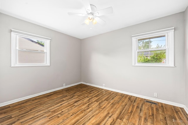 440 Berkshire Ave, Romeoville, IL 60446 - empty room featuring baseboards, wood finished floors, and ceiling fan