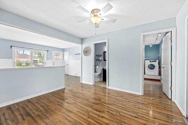 440 Berkshire Ave, Romeoville, IL 60446 - unfurnished living room featuring washer / clothes dryer, a ceiling fan, wood finished floors, baseboards, and track lighting
