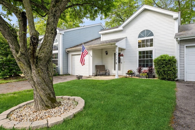 3512 Southport Dr, Island Lake, IL 60042 - view of front facade featuring a front lawn, a garage, concrete driveway, and a shingled roof