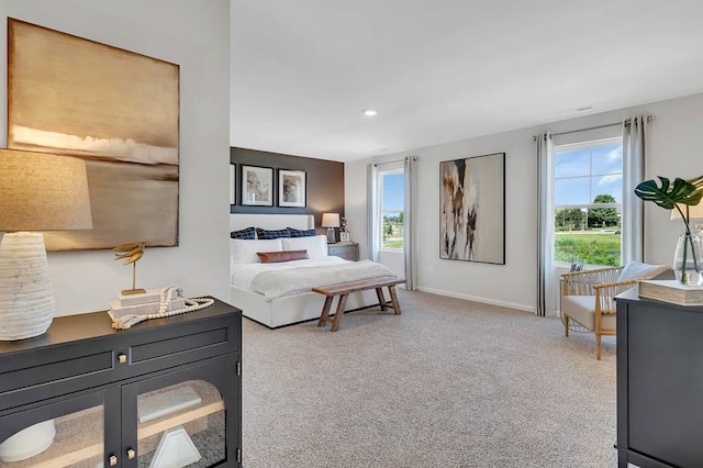 bedroom with multiple windows, carpet flooring, baseboards, and recessed lighting