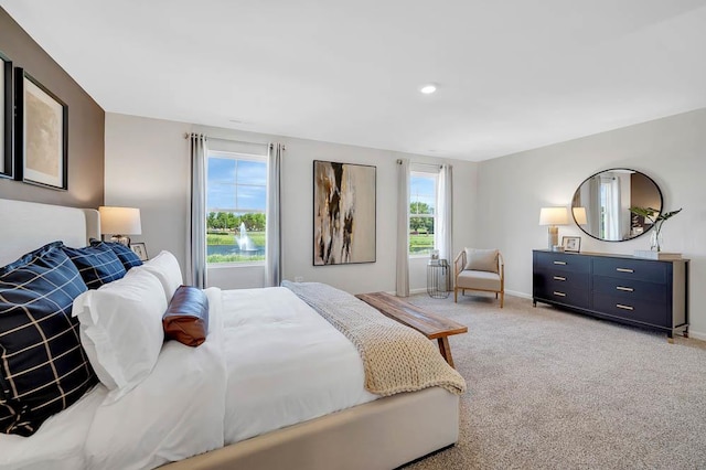 bedroom featuring light carpet, baseboards, and recessed lighting