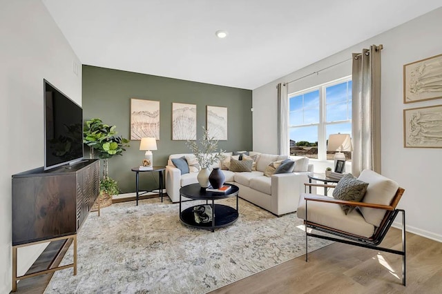 living room featuring wood finished floors and baseboards
