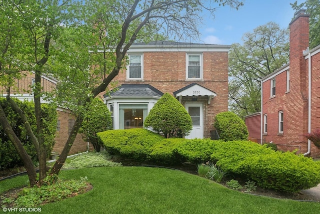 5530 Theobald Rd, Morton Grove, IL 60053 - view of front of house featuring a front lawn and brick siding
