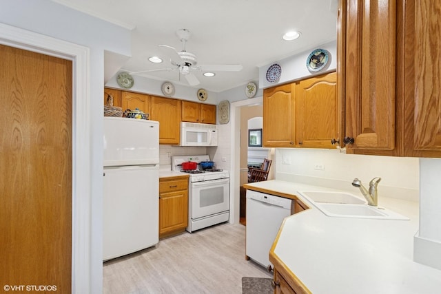 5530 Theobald Rd, Morton Grove, IL 60053 - kitchen with white appliances, a sink, a ceiling fan, decorative backsplash, and light countertops