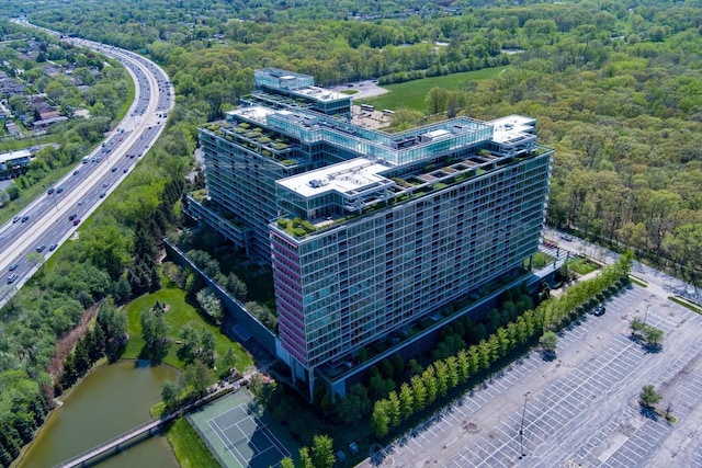 9655 Woods Dr Unit 402, Skokie, IL 60077 - drone / aerial view of a major roadway, a nearby body of water, and a forest