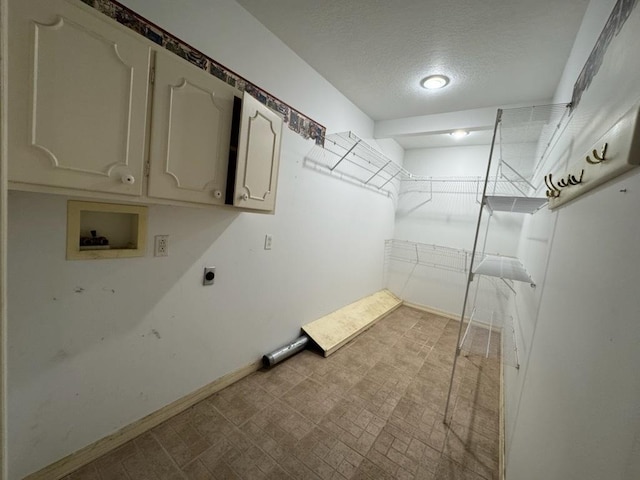 110 Martin Dr, Rock Falls, IL 61071 - laundry area with cabinet space, washer hookup, a textured ceiling, and hookup for an electric dryer
