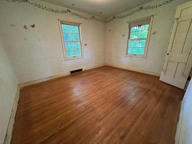 110 Martin Dr, Rock Falls, IL 61071 - unfurnished room with wood finished floors and healthy amount of natural light
