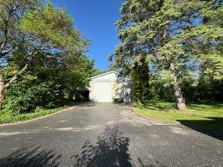 110 Martin Dr, Rock Falls, IL 61071 - view of front of property featuring driveway, an outdoor structure, and a garage