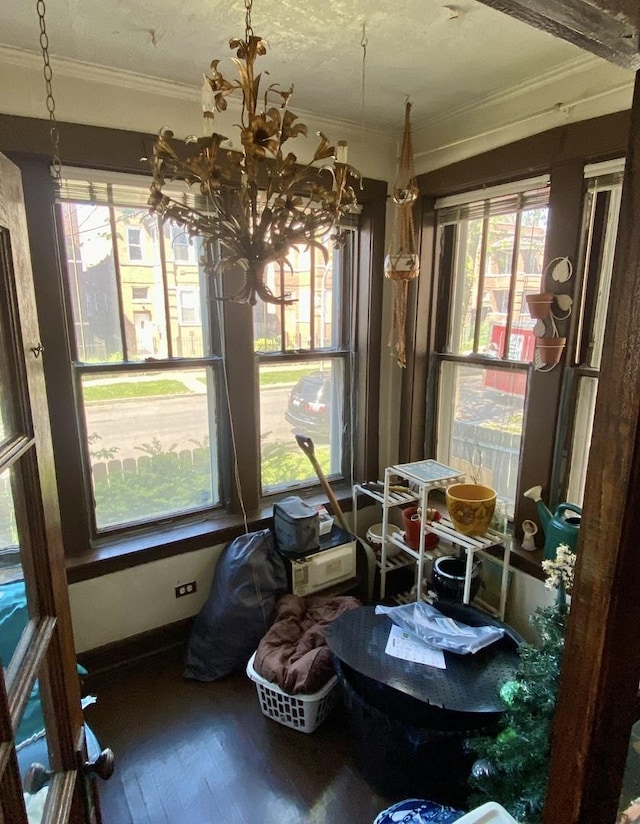 4943 W Monroe St, Chicago, IL 60644 - dining room featuring ornamental molding, plenty of natural light, wood finished floors, and a chandelier