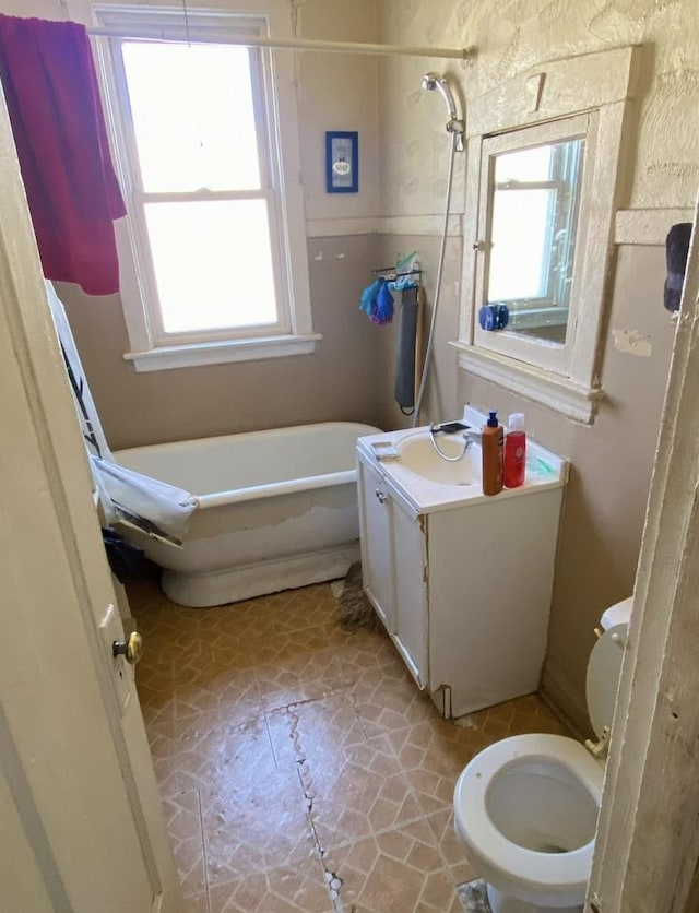 4943 W Monroe St, Chicago, IL 60644 - full bathroom featuring a freestanding bath, toilet, vanity, and a shower