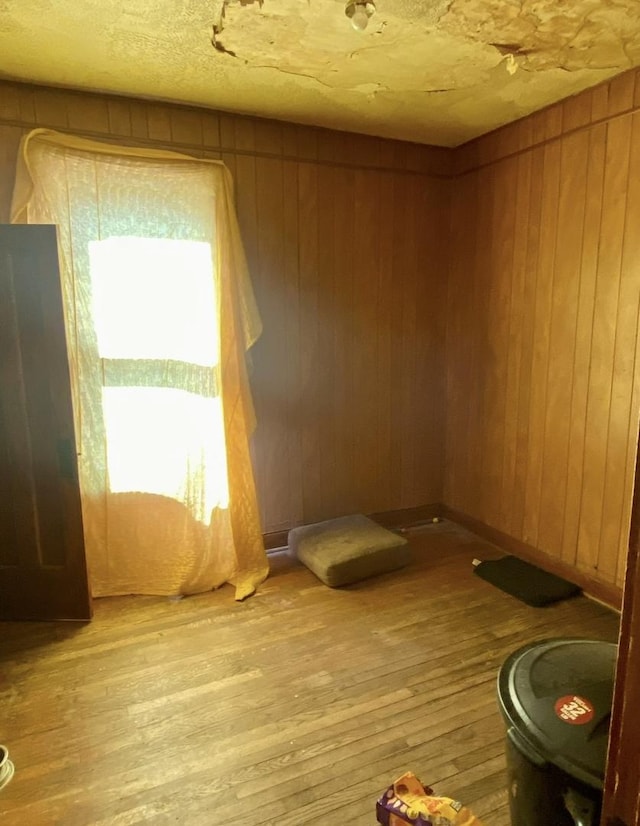 4943 W Monroe St, Chicago, IL 60644 - empty room with light wood-style flooring and wood walls