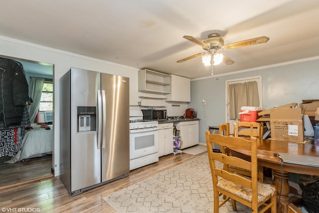 10 S Hickory Ave, Fox Lake, IL 60020 - kitchen featuring stainless steel appliances, open shelves, light wood-type flooring, white cabinets, and a ceiling fan