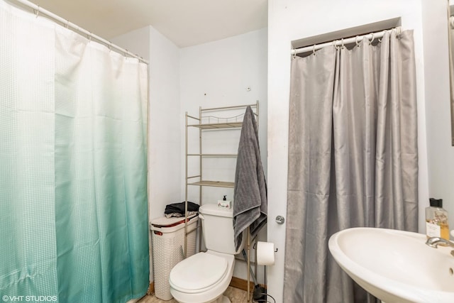 10 S Hickory Ave, Fox Lake, IL 60020 - full bathroom featuring a sink, toilet, and a shower with shower curtain