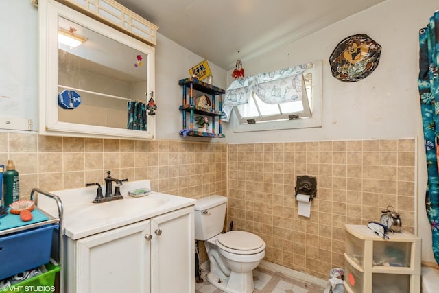 10 S Hickory Ave, Fox Lake, IL 60020 - bathroom with tile walls, vanity, toilet, curtained shower, and tile patterned floors