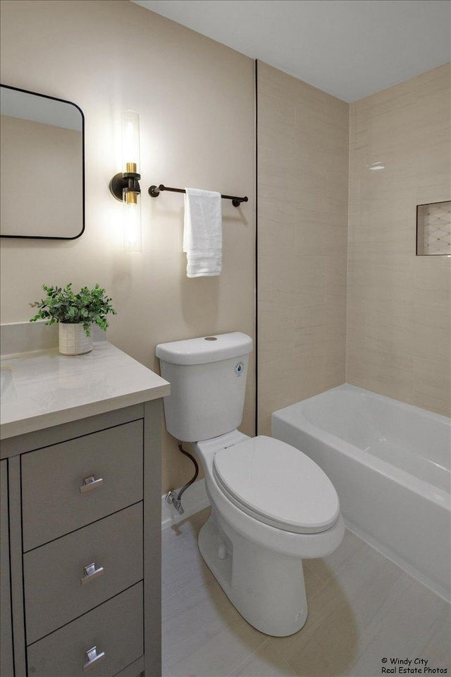 884 Greenview Ave, Des Plaines, IL 60016 - full bathroom featuring toilet, vanity, and tile patterned flooring