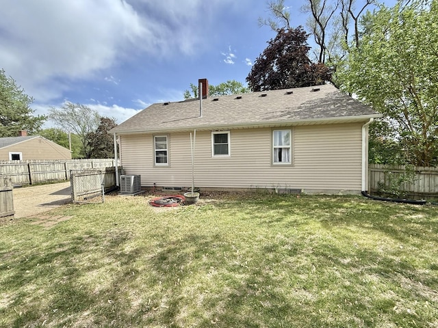 1010 Brentwood Rd, Machesney Park, IL 61115 - rear view of property with central air condition unit, a shingled roof, and crawl space