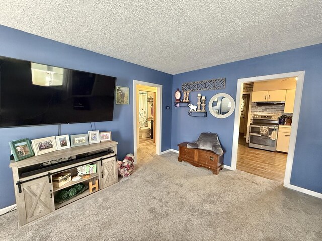 1010 Brentwood Rd, Machesney Park, IL 61115 - living area featuring carpet, a textured ceiling, and baseboards