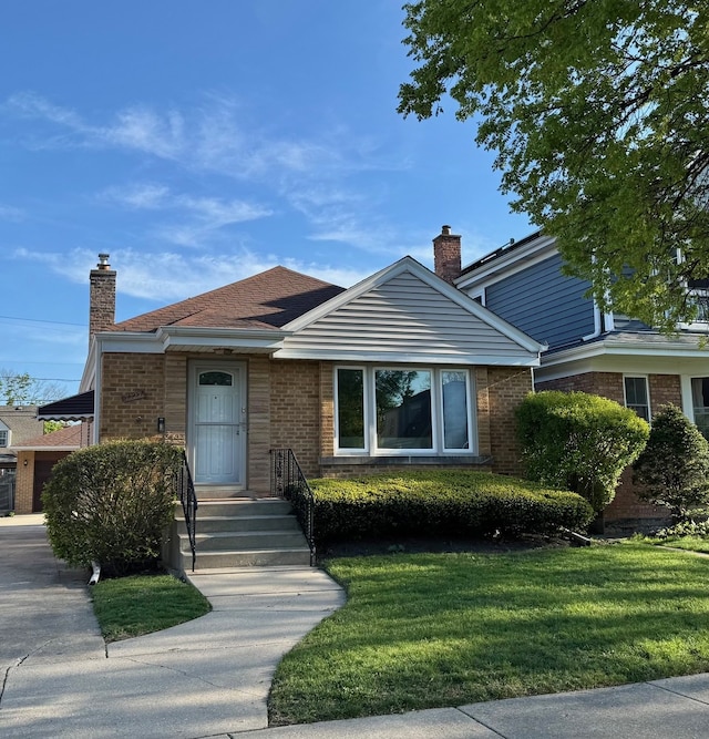 7727 W Palatine Ave, Chicago, IL 60631 - bungalow-style house featuring brick siding, a chimney, and a front yard