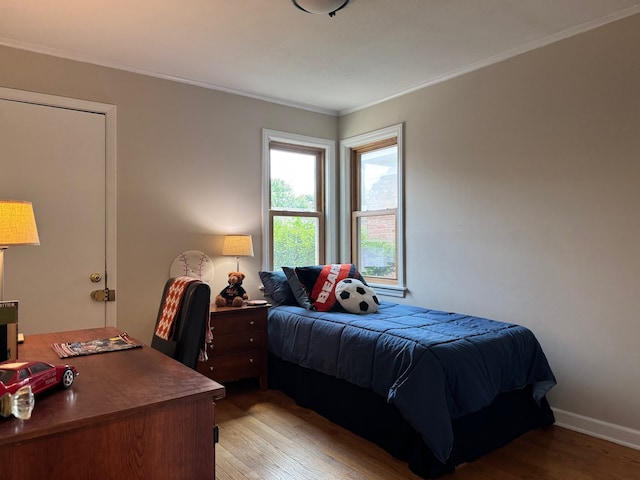 7727 W Palatine Ave, Chicago, IL 60631 - bedroom with light wood-type flooring and crown molding