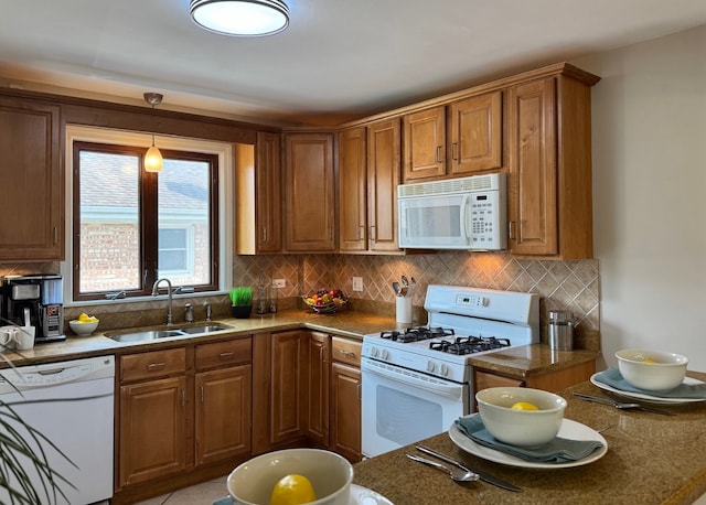 7727 W Palatine Ave, Chicago, IL 60631 - kitchen featuring a sink, white appliances, brown cabinets, and tasteful backsplash