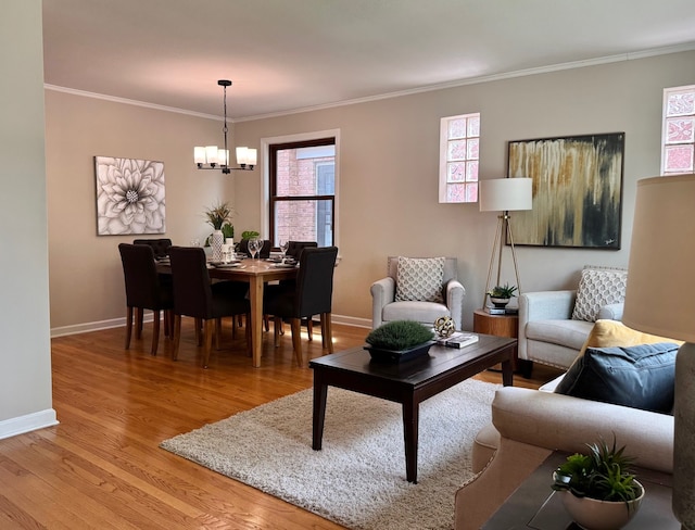 7727 W Palatine Ave, Chicago, IL 60631 - living room featuring a chandelier, light wood-style flooring, baseboards, and ornamental molding