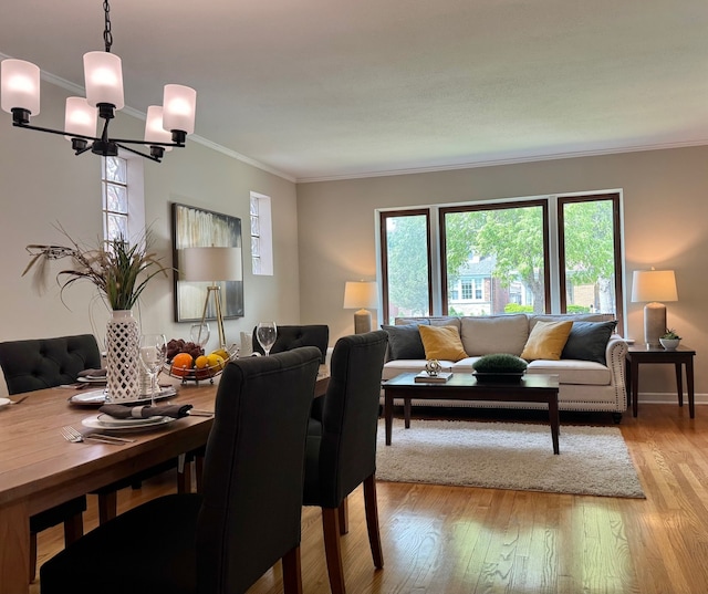 7727 W Palatine Ave, Chicago, IL 60631 - dining space with a chandelier, crown molding, light wood-type flooring, and baseboards