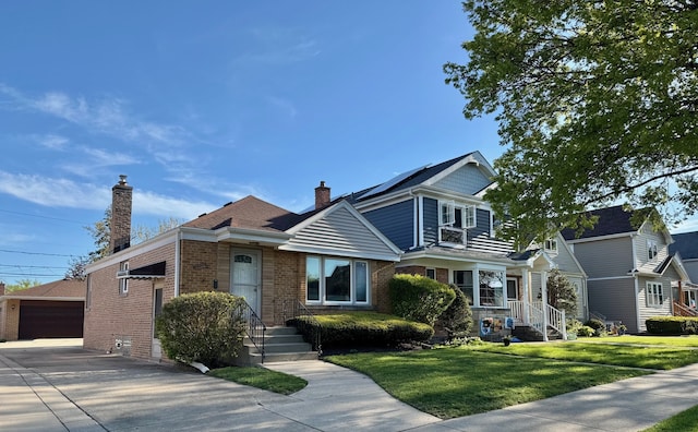7727 W Palatine Ave, Chicago, IL 60631 - view of front of house with brick siding, a chimney, a front lawn, an outdoor structure, and a detached garage