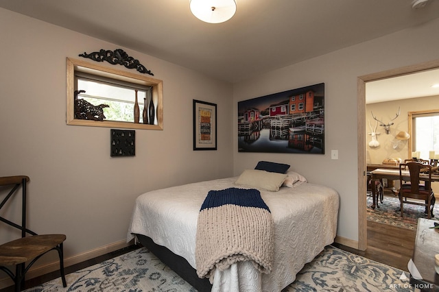 6928 Pershing Rd, Berwyn, IL 60402 - bedroom with wood finished floors and baseboards