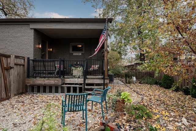 6928 Pershing Rd, Berwyn, IL 60402 - rear view of property featuring a wooden deck and a fenced backyard