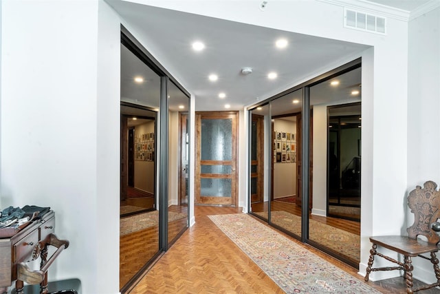 hall with ornamental molding, recessed lighting, and baseboards