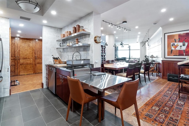 dining area with recessed lighting, ornamental molding, and rail lighting